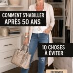 Femme élégamment habillée après 50 ans, souriante et confiante, dans un jardin en fleur.
